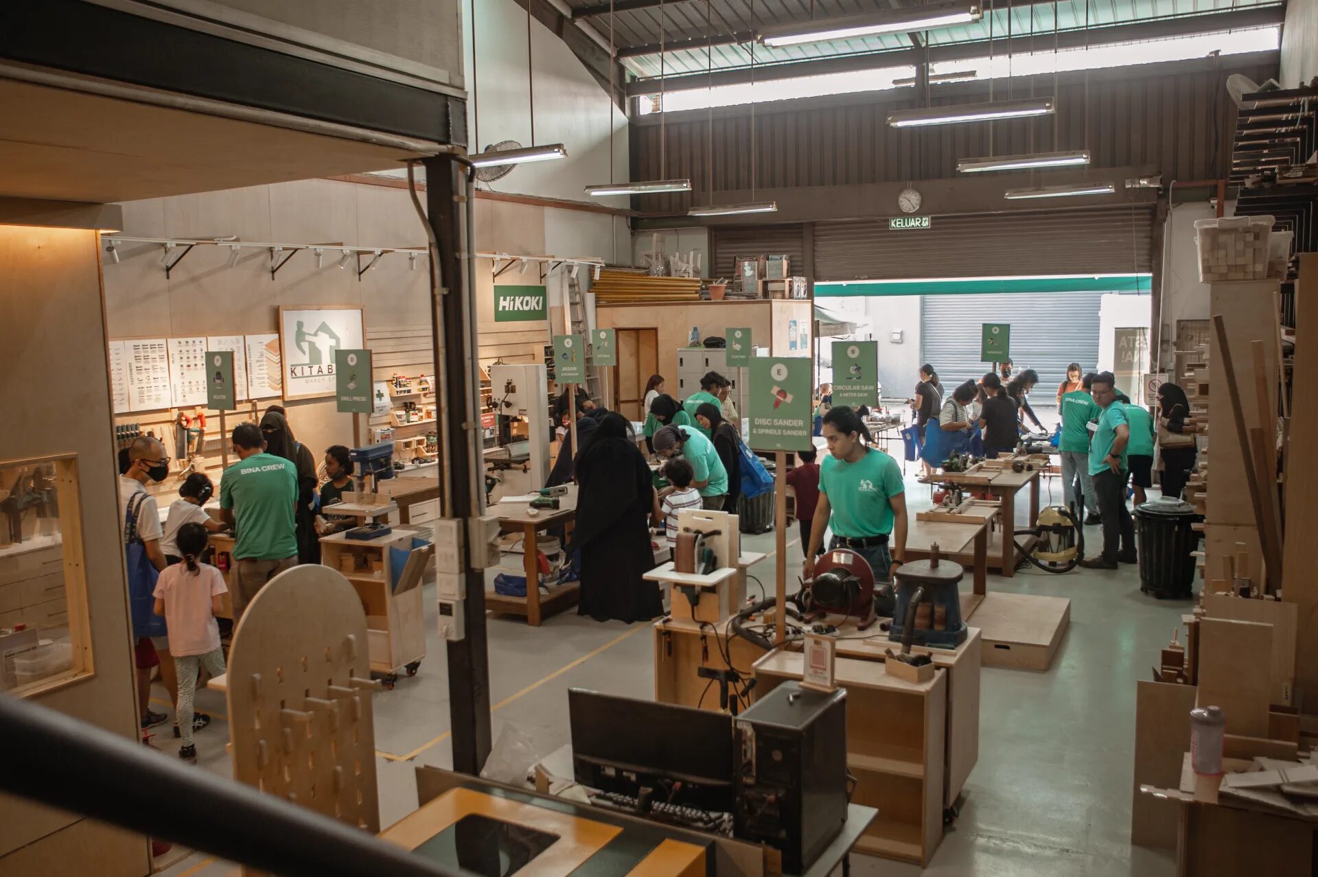 The Pesta Bina floor mid-festival, makers working across a dozen tool areas