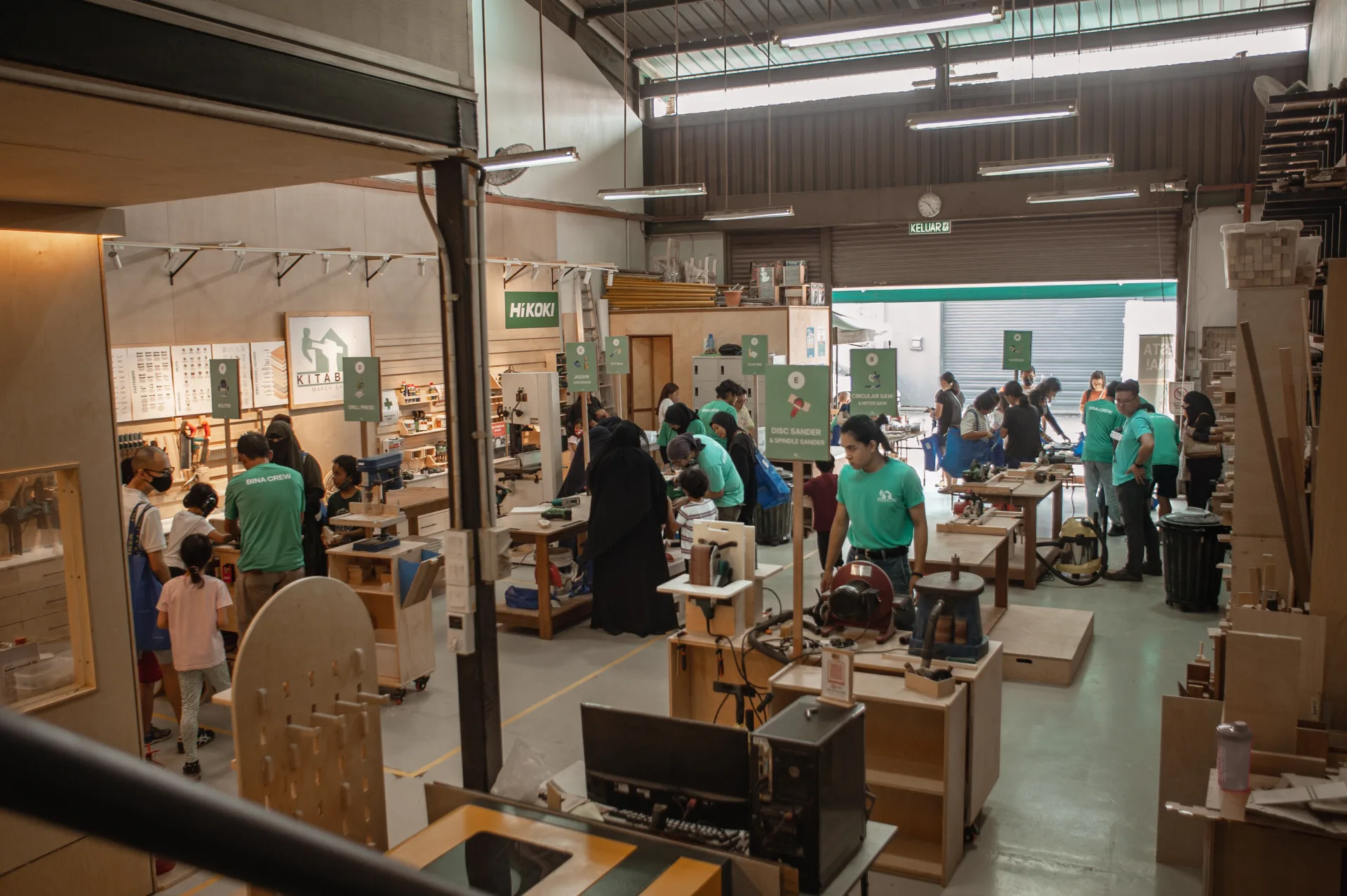 The Pesta Bina floor mid-festival, makers working across a dozen tool stations
