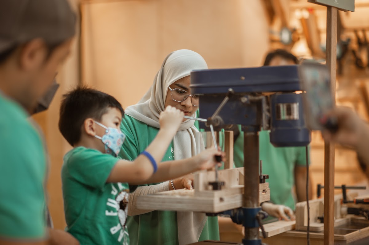 Instructor teaching a child